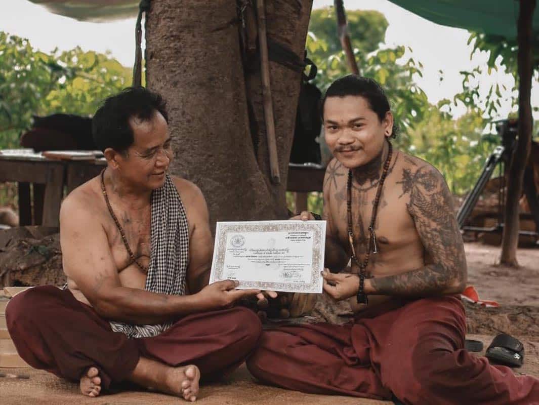 Sak Yant master holding a professional certificate