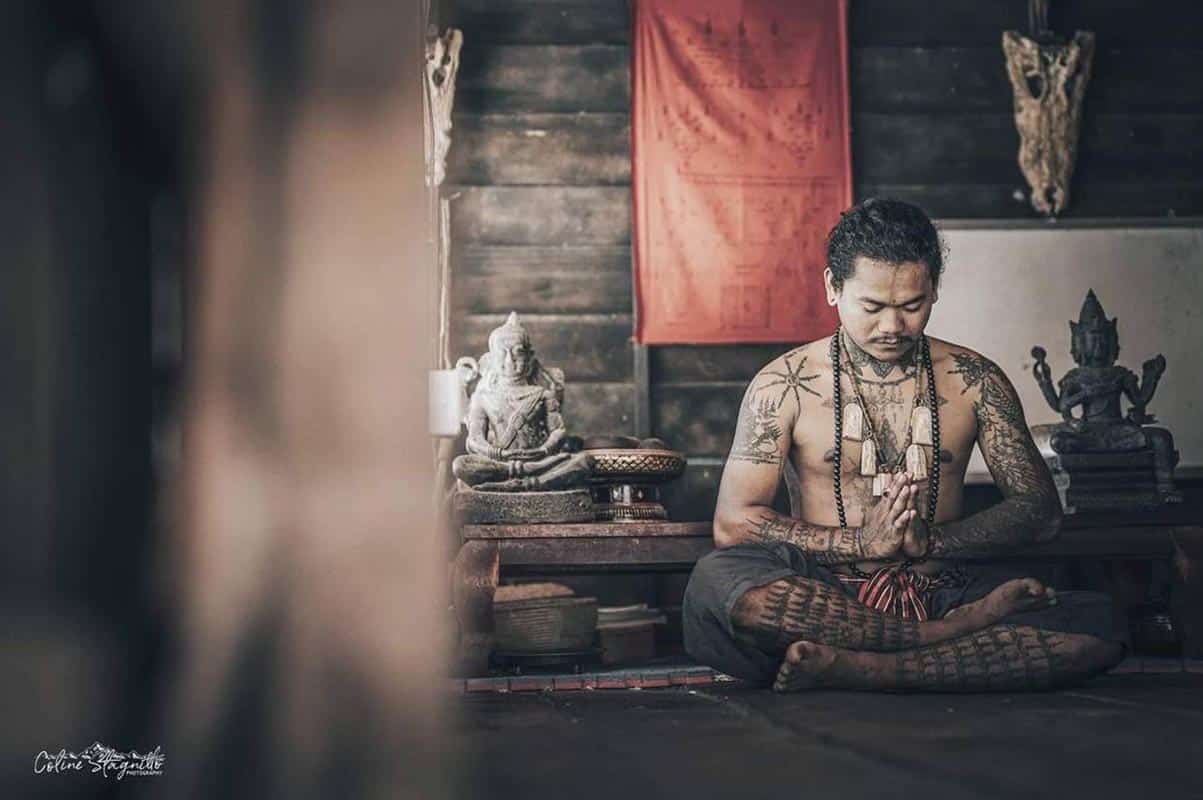 A Sak Yant master in a moment of prayer
