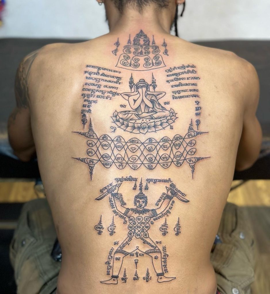 A full back tattoo in Sak Yant style