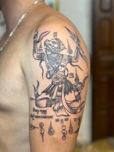 Arm tattoo of Hanuman in Sak Yant style